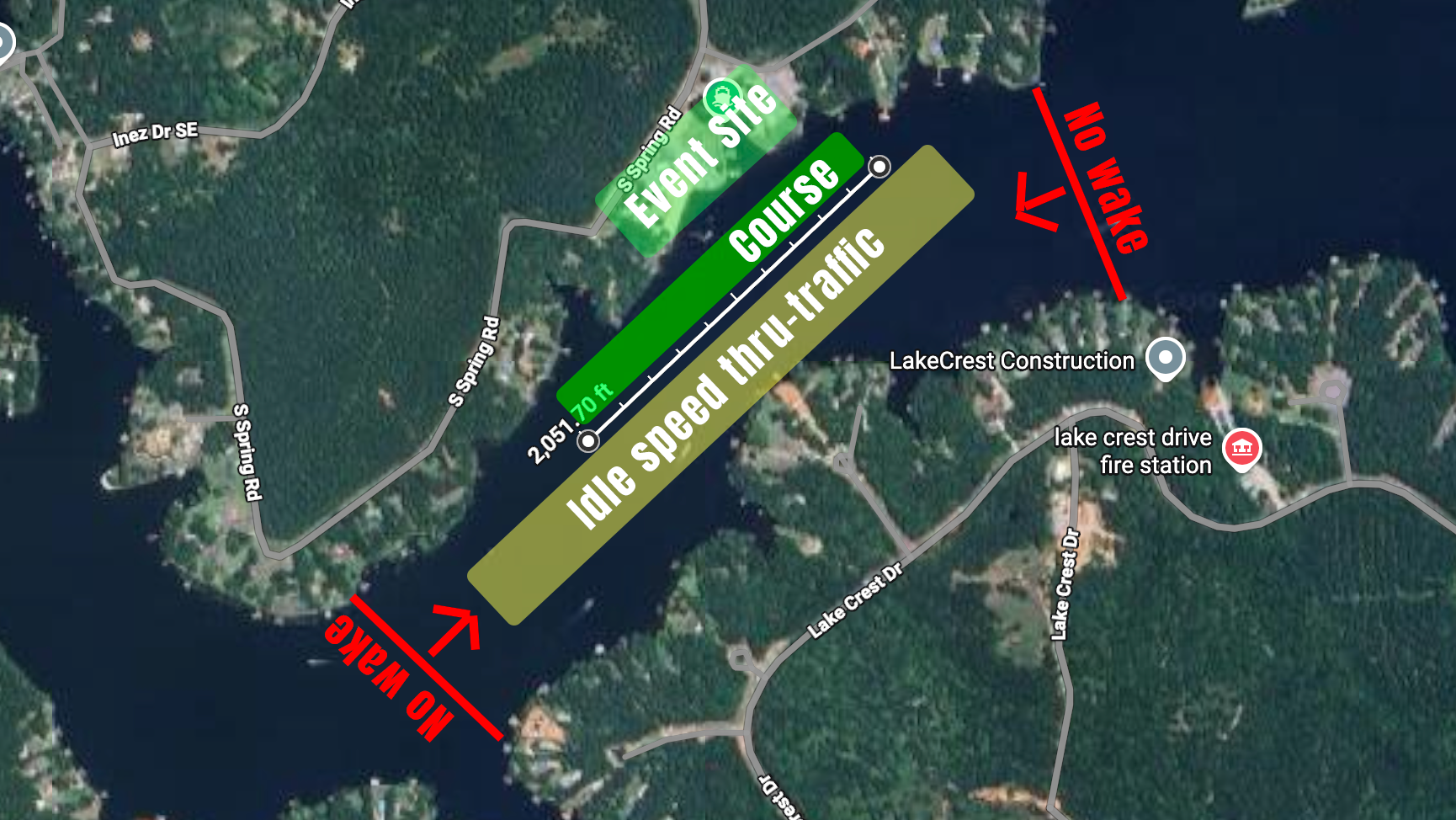 A map of a location showing a lake with surrounding roads, construction zones, and designated areas for event activities and traffic flow, including labels for a course, throug-traffic, and event site.