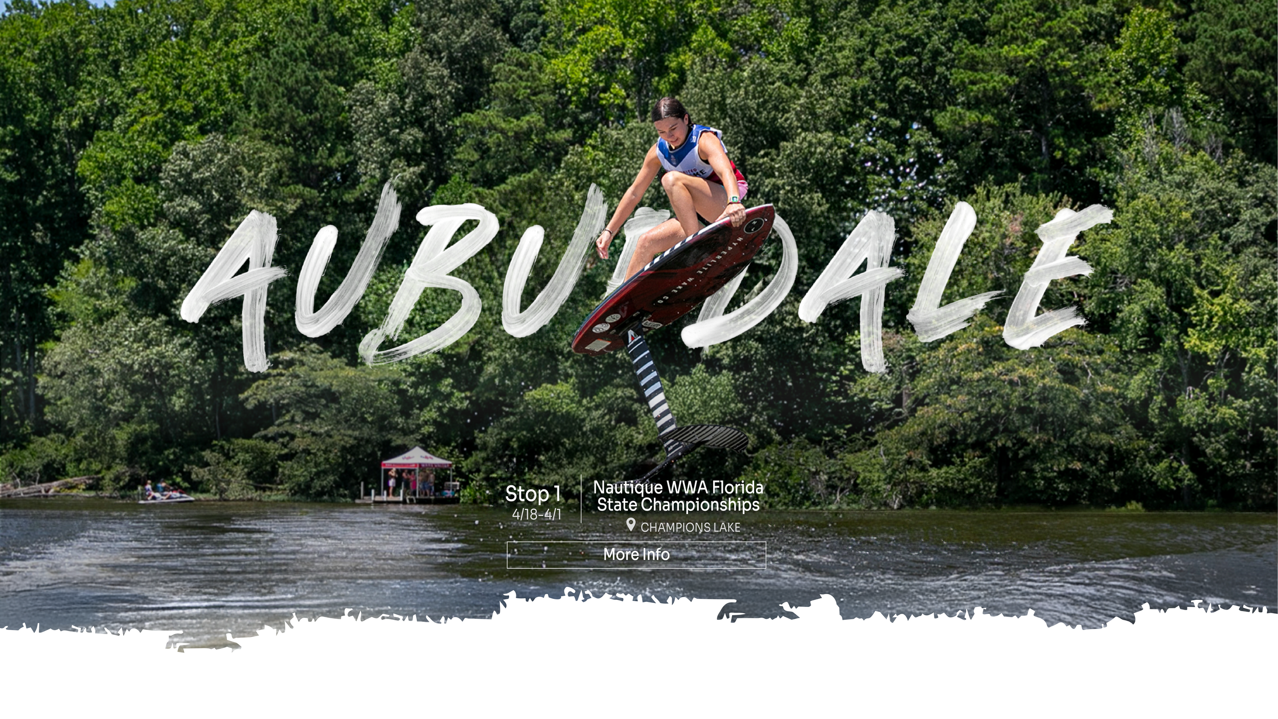 A woman performing a wakeboard trick in the water during the Nautique WWA Florida State Championships at Champions Lake, with lush green trees in the background and the word 'AUBURNDALE' written across the image.