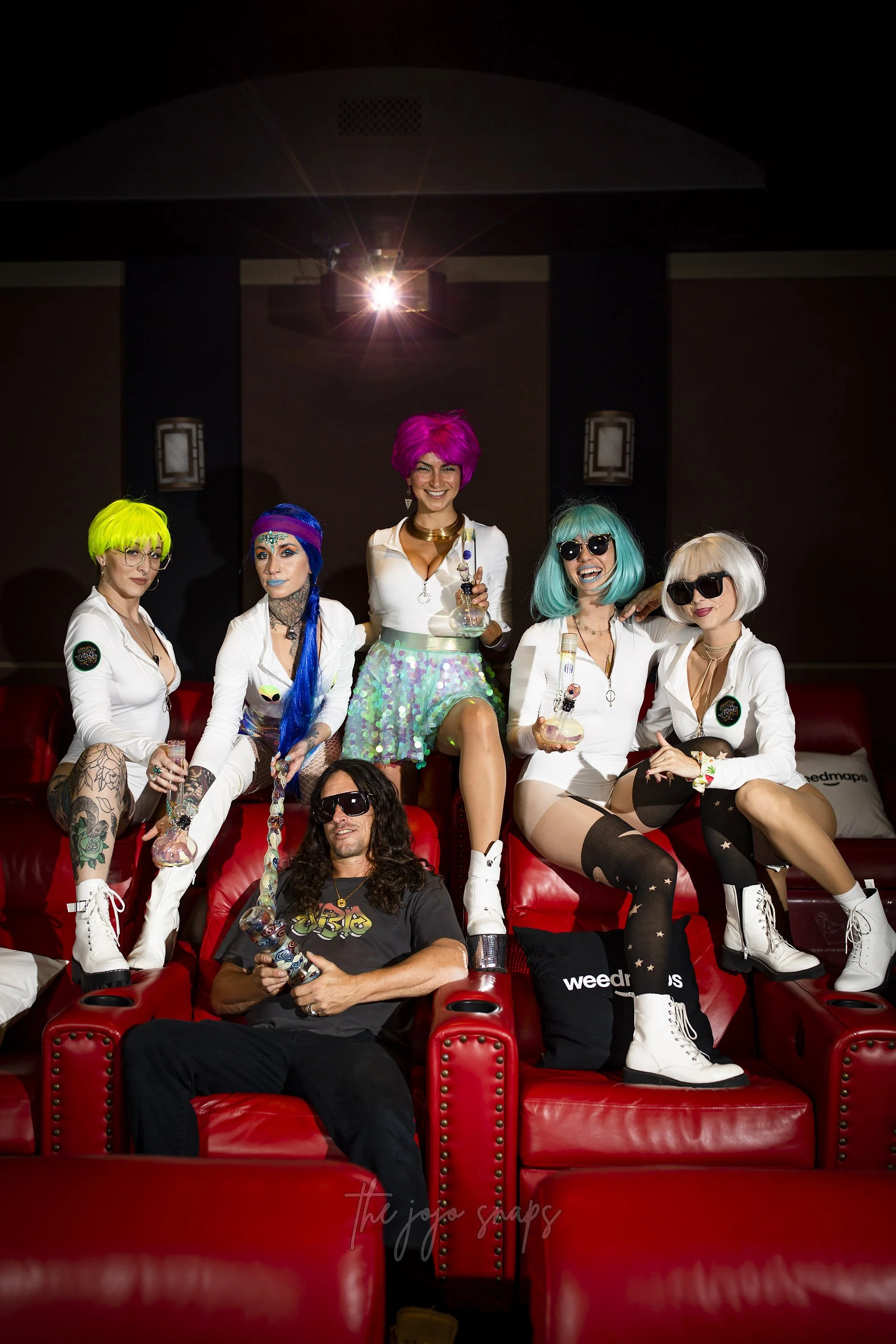 Jason Harris, AKA Jerome Baker posing with his bong babes at a Super Bowl Party