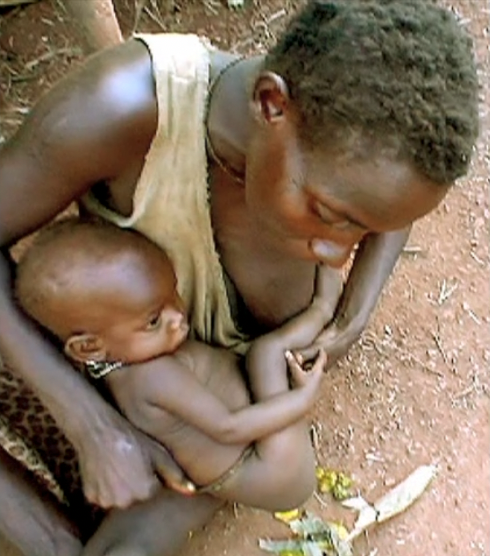 babypottying.co.uk  africa mother holding baby to poo.png