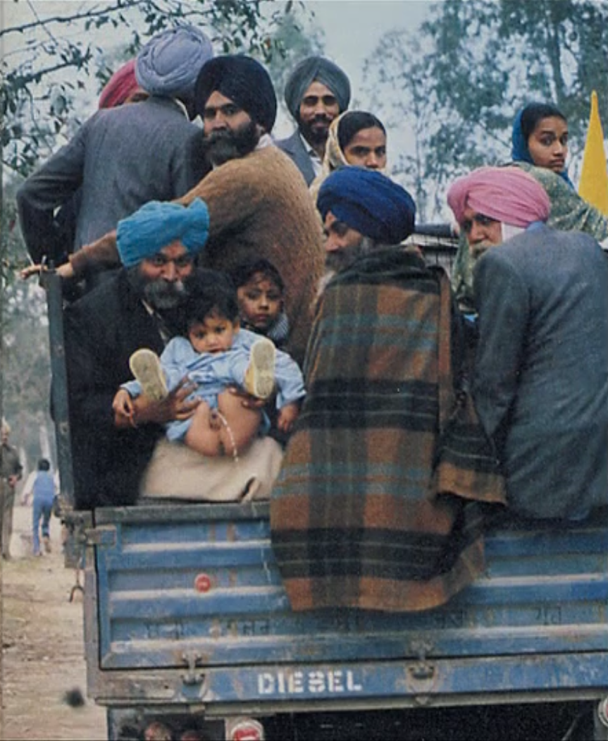babypottying.co.uk india boy weeing off vehicle .png
