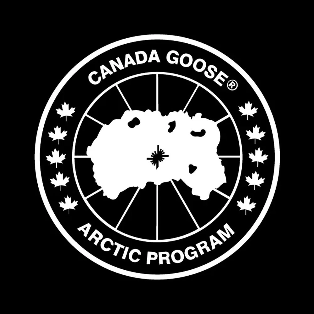 Black and white logo for Canada Goose Arctic Program featuring a polar bear surrounded by a circular border with maple leaves and program text.