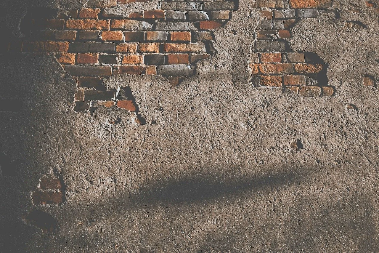 brick wall to hide trauma behind