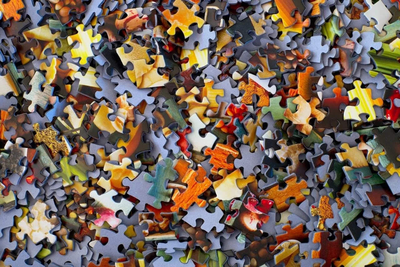 puzzle pieces in a pile like symptoms of CPTSD