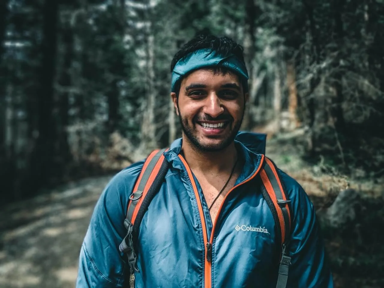 man on a hiking trail with backpack