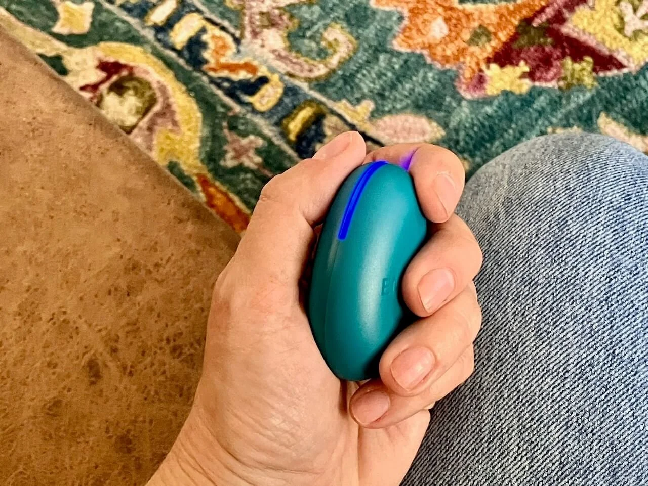 EMDR tapper in a hand in Elizabeth Peters' office with a rug background