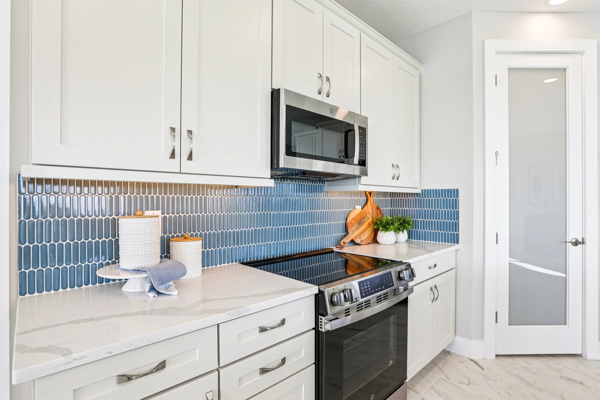 The Kitchen Backsplash of a DRB Homes Bimini Model at Isla Mirada in San Antonio, FL.
