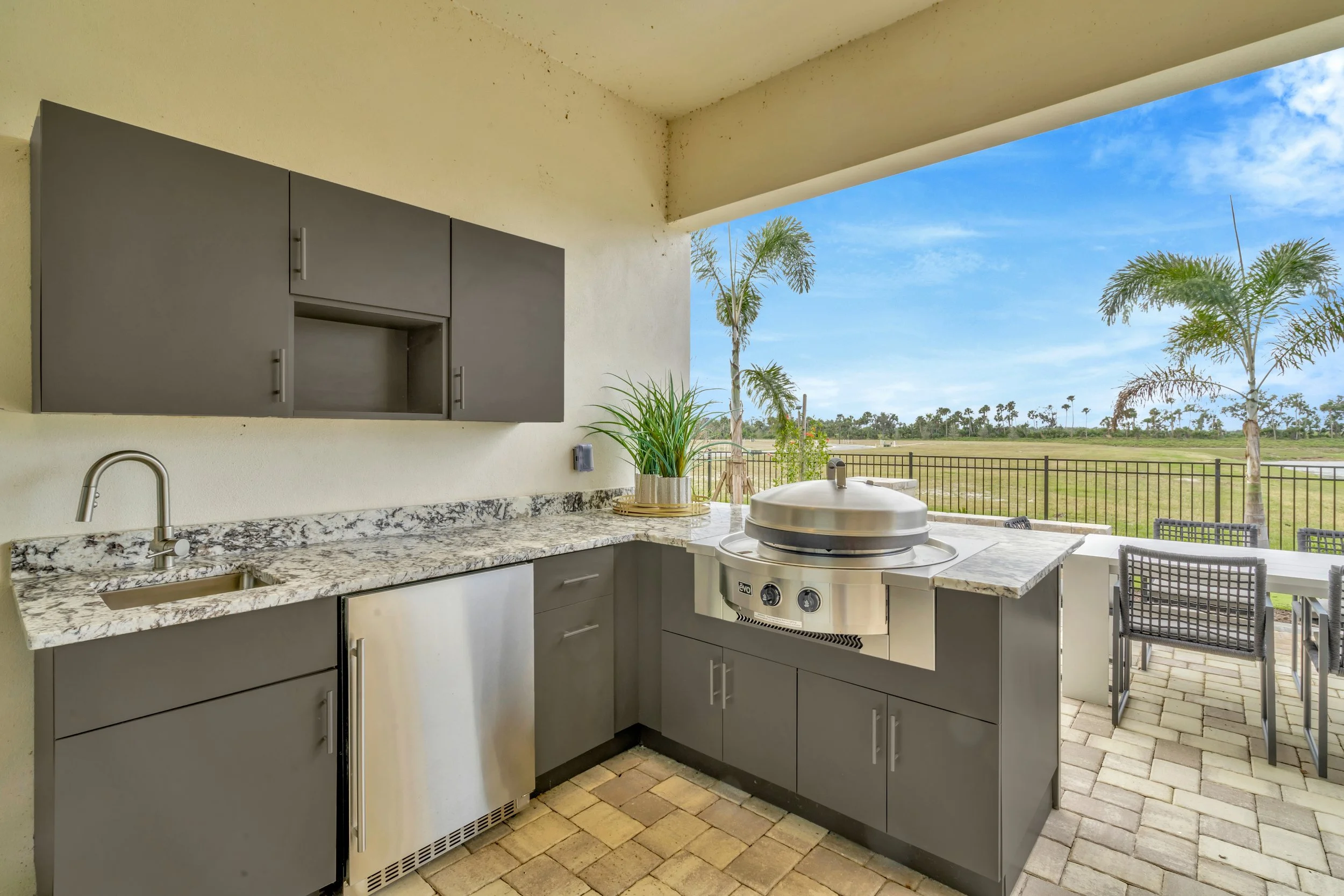 The Outdoor Kitchen of a DRB Homes Grand Eider Model at Biscayne Landing at Seaire in Parrish, FL.