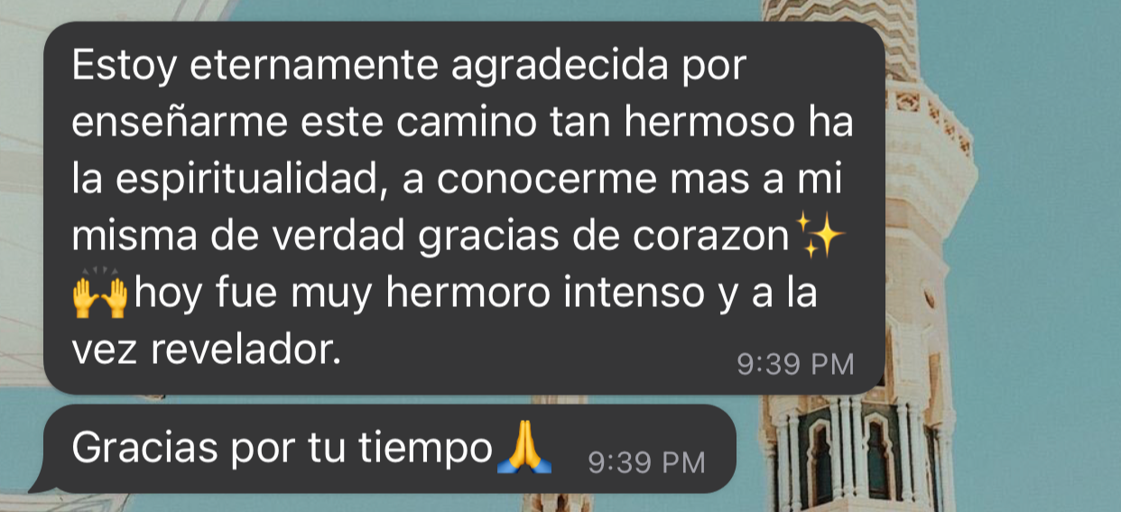 Screenshot of a text message in Spanish expressing gratitude for a spiritual journey, with a photo of a historic building with a tower in the background.