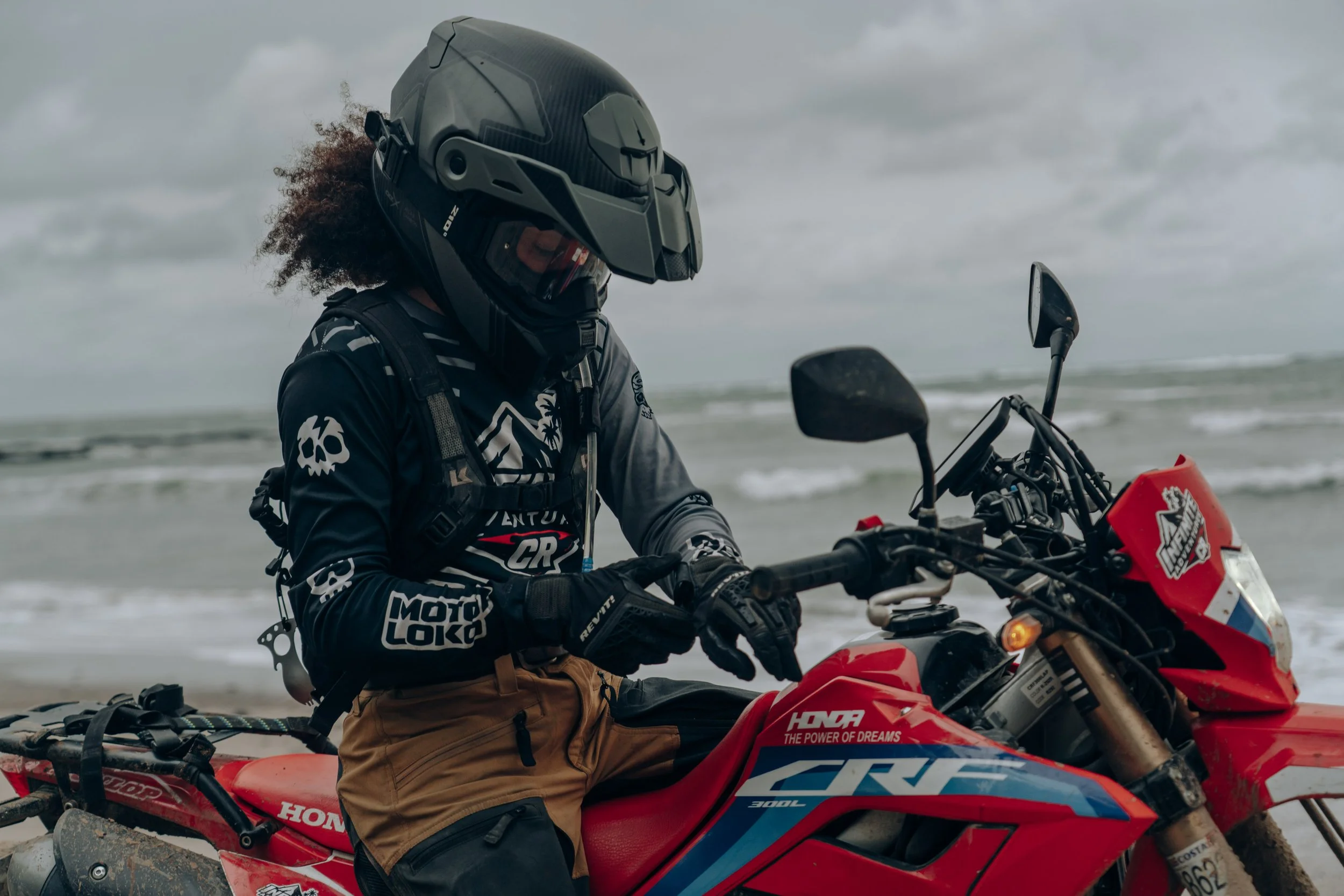 Golnoosh Namazi on a dirt bike on a beach in Costa Rica while filming a project with Infinite Adventures.