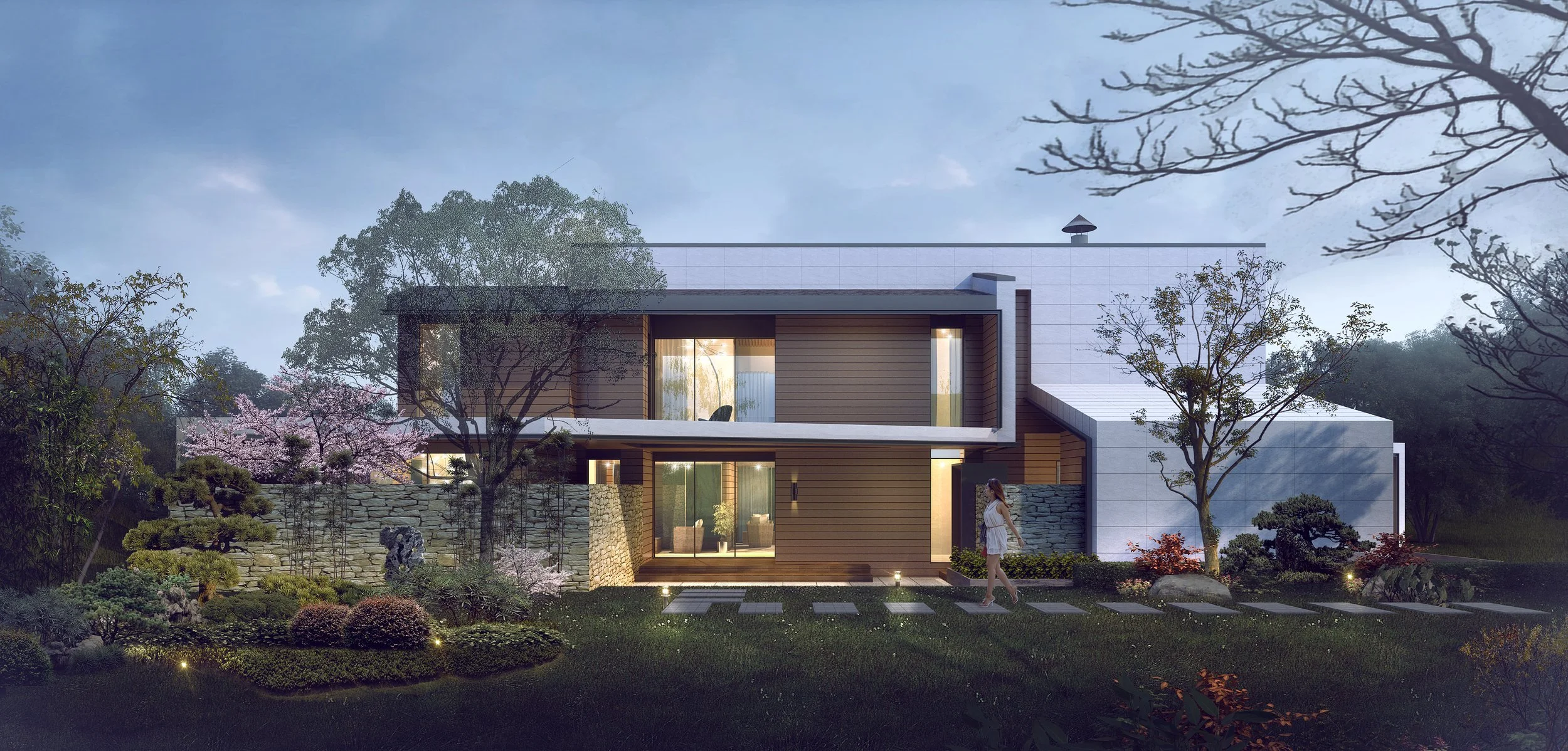 Modern two-story house surrounded by landscaped garden with trees, bushes, and flowers, during dusk, with a woman walking on the lawn.