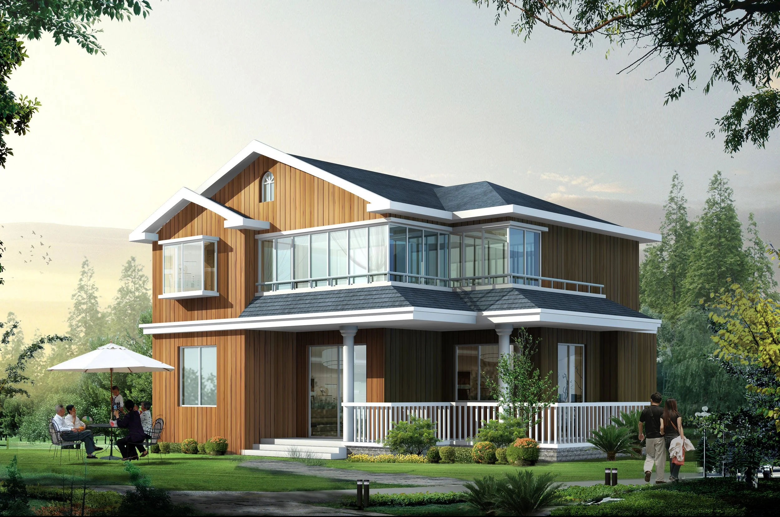 A modern three-story house with wooden exterior siding, large windows, and a wrap-around porch surrounded by a lush green yard. Several people are gathered outside, sitting and standing near the house, with some under a white patio umbrella. The scen