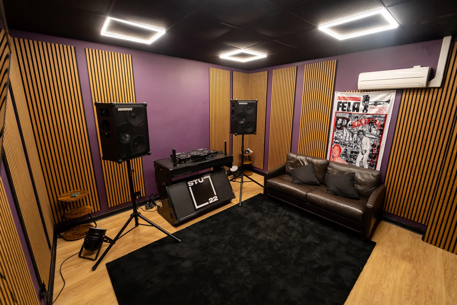 DJ room hire London: soundproof DJ booth with Denon DJ Prime decks, wood panelling and seating at The Portal, STU 22 Wapping