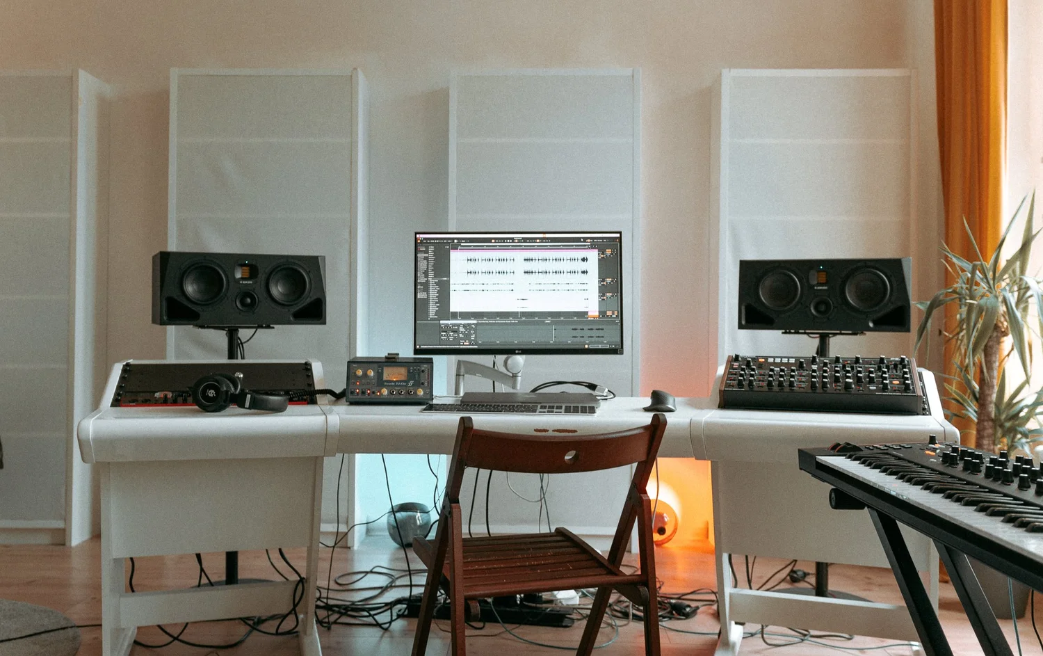 A pair of ADAM Audio A77H studio monitors set up on a desk, the same monitors used for mixing in the music studio at STU 22 in Wapping