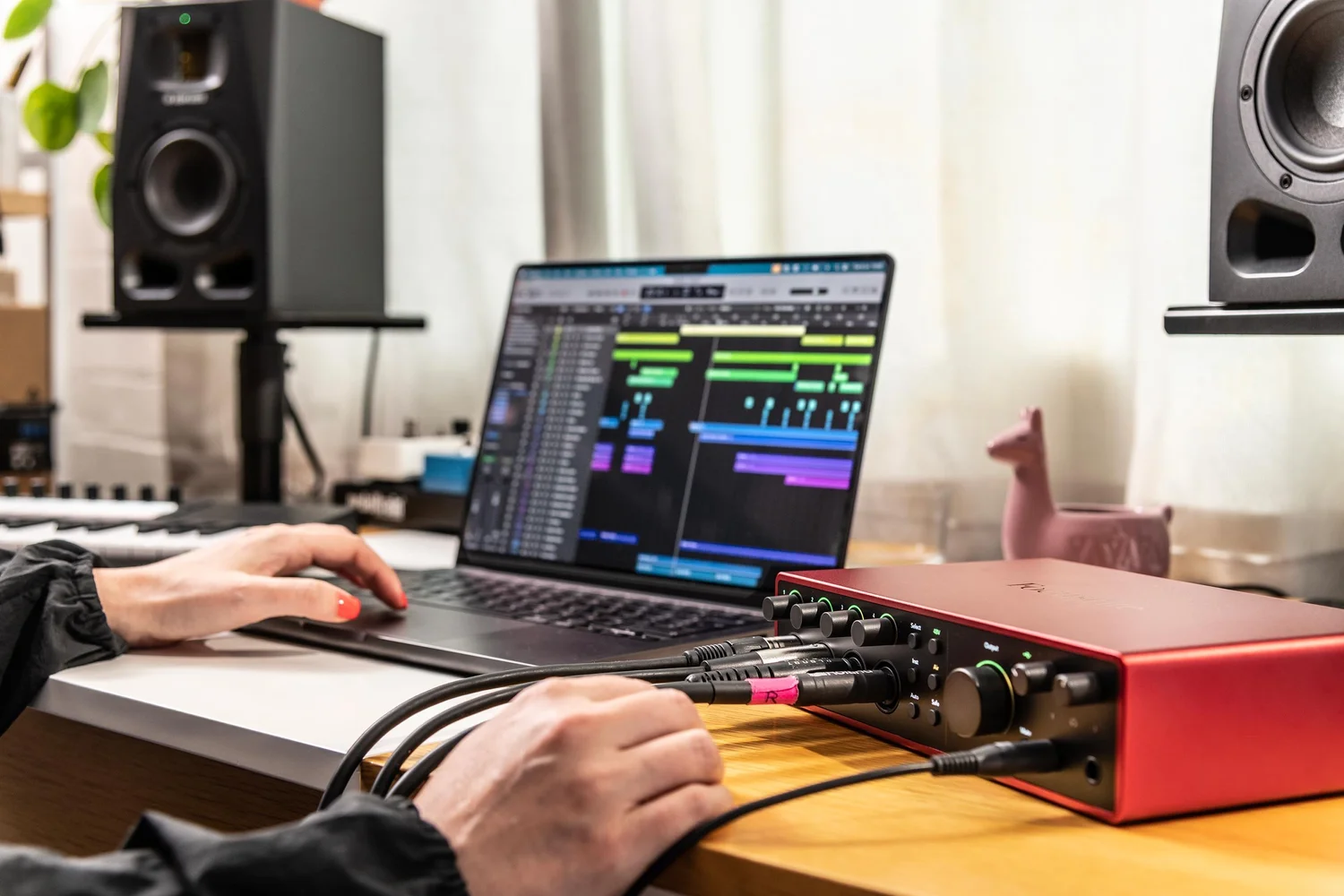 Close up of a Focusrite Scarlett 18i16 in use on a studio desk, the same interface you record through in The Portal at STU 22