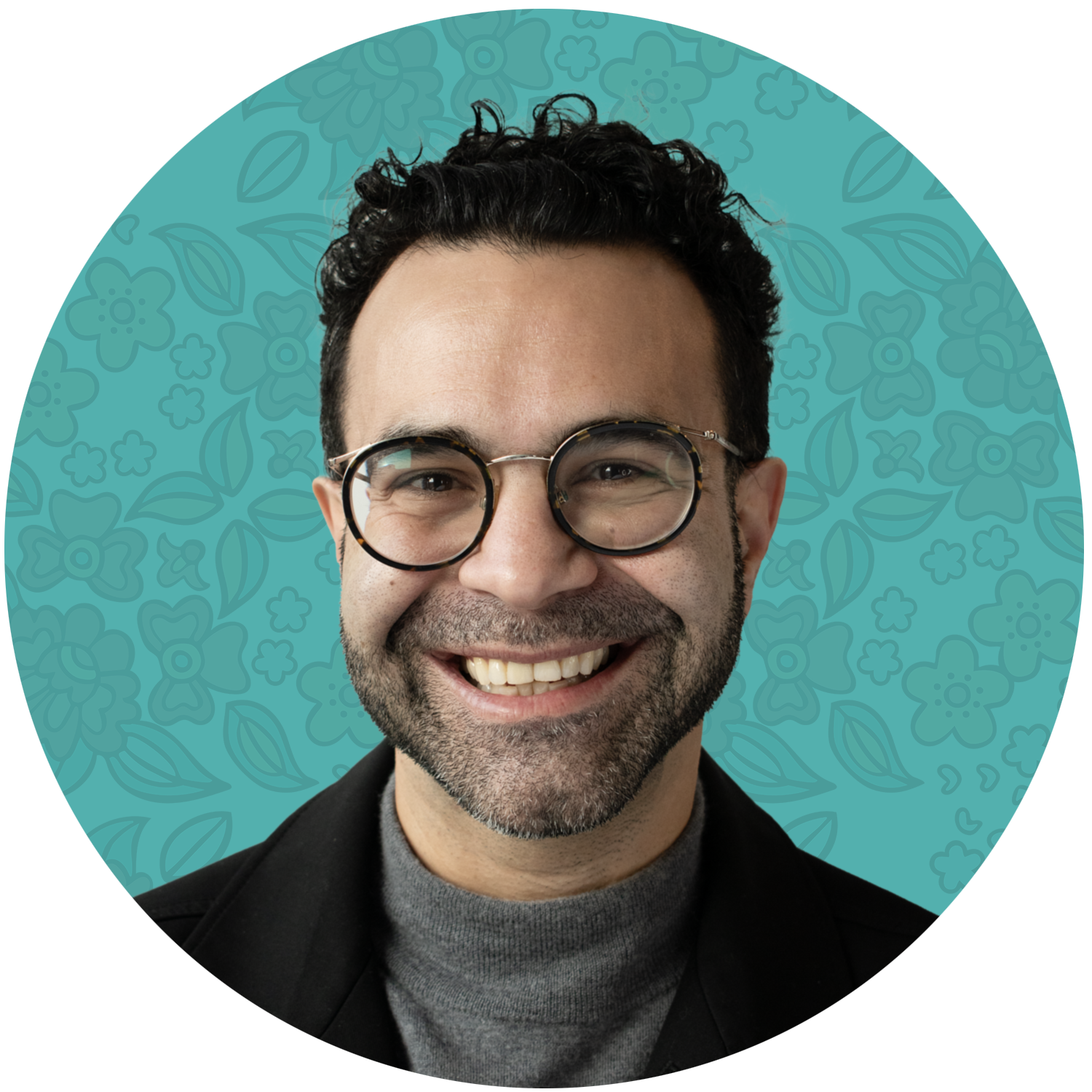 Omar Mouallem. Podcast Producer. A smiling man with dark curly hair and glasses, wearing a gray turtleneck and black blazer, in front of a light blue background with floral patterns.