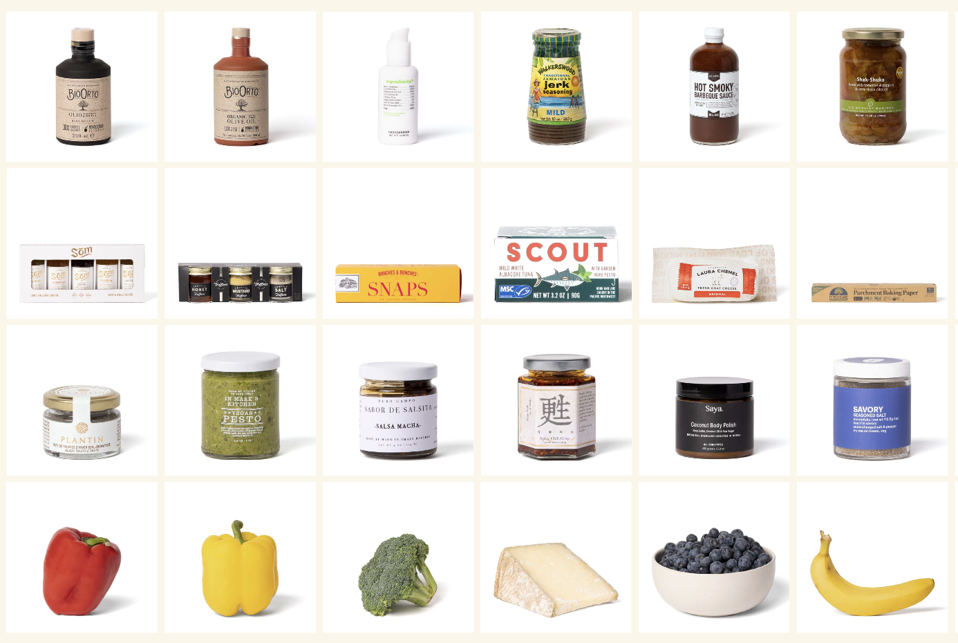 Collection of various food items and condiments, including jars of sauces, spice tins, packaged snacks, and fresh produce such as red and yellow bell peppers, broccoli, cheese, blueberries, and a banana.