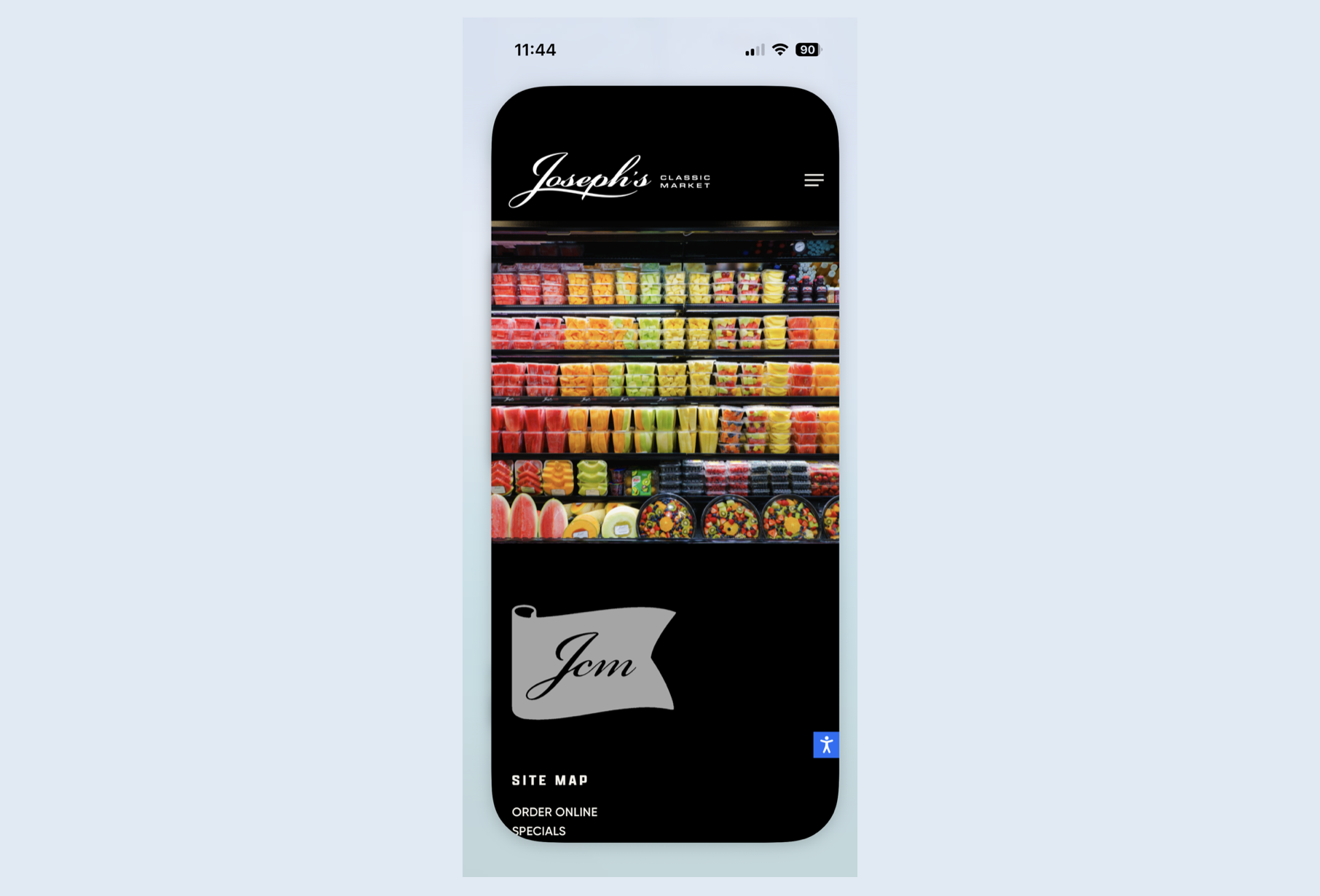A mobile phone screen displays the website of Joseph's Classic Market, showing a colorful display of packaged fruit slices and desserts on store shelves. Robert Ranfranz branding, design and ecommerce.