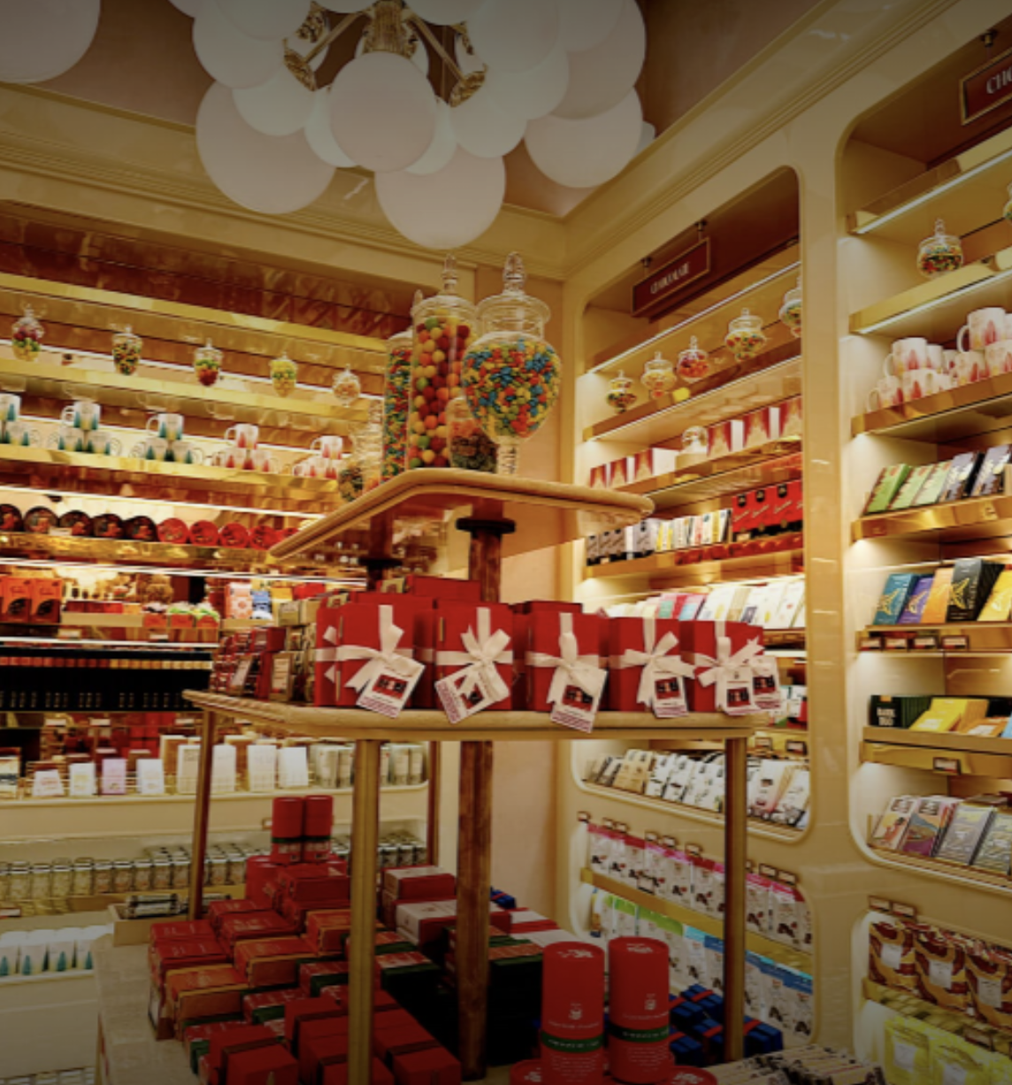 Candy store with jars of colorful candy and shelves of chocolates and sweets