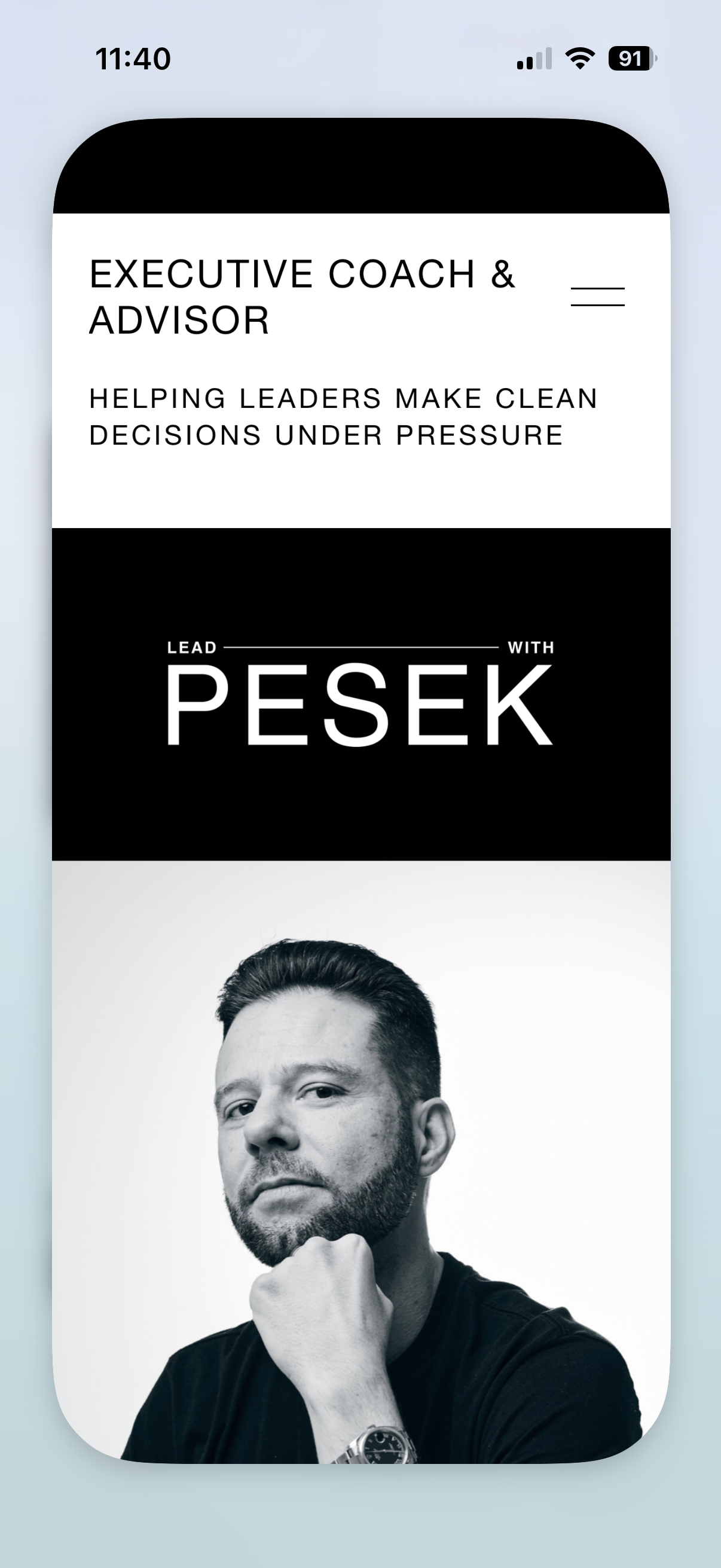 A mobile phone screen showing a website for an executive coach and advisor, with the headline 'Helping leaders make clean decisions under pressure' and a black-and-white photo of a man with a beard, short hair, and a thoughtful expression, wearing a watch.