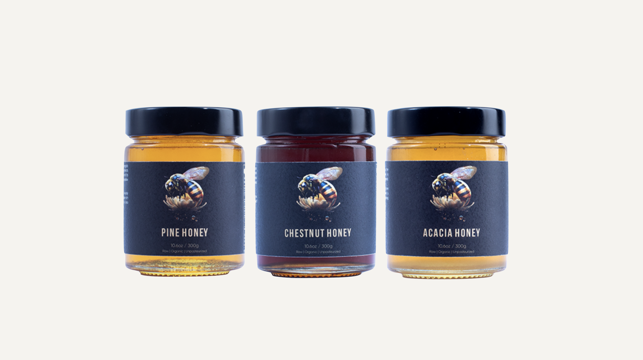 Three jars of honey labeled Pine Honey, Chestnut Honey, and Acacia Honey, with bee illustrations on the labels, set against a plain background. Maison Connoisseur Honey. Robert Ranfranz.
