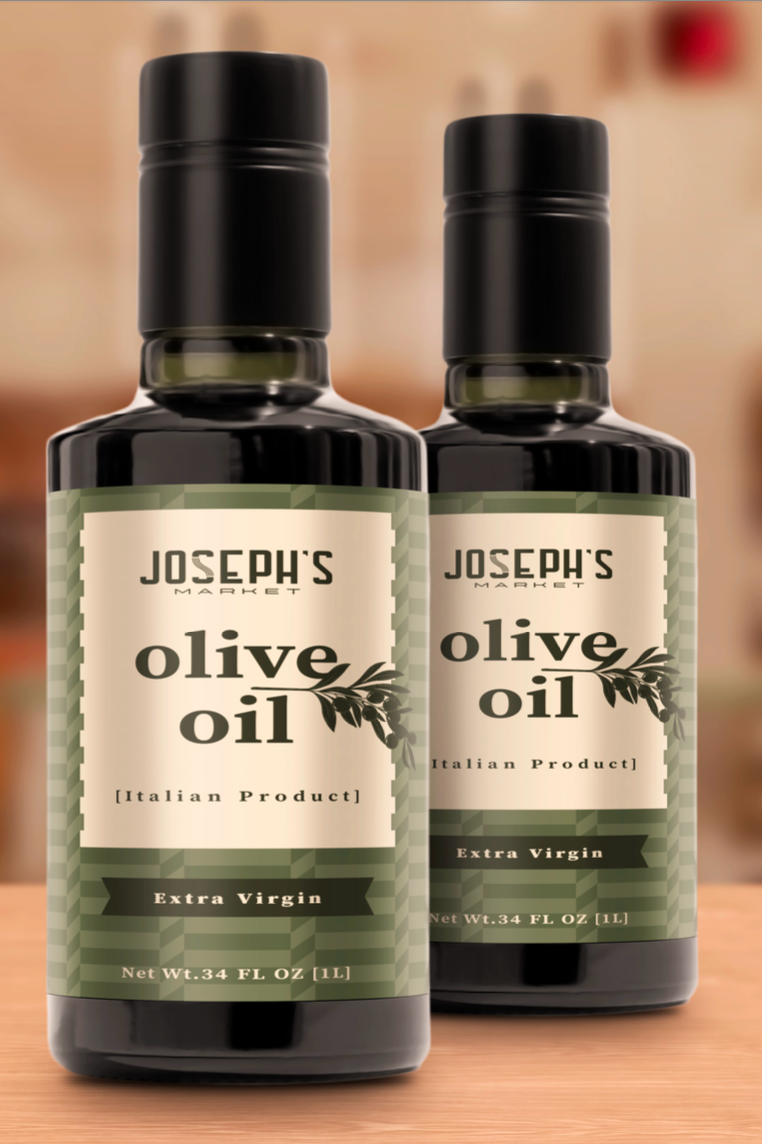 Two bottles of Joseph's Market olive oil with labels indicating 'Extra Virgin' and 'Italian Product' on a wooden surface.