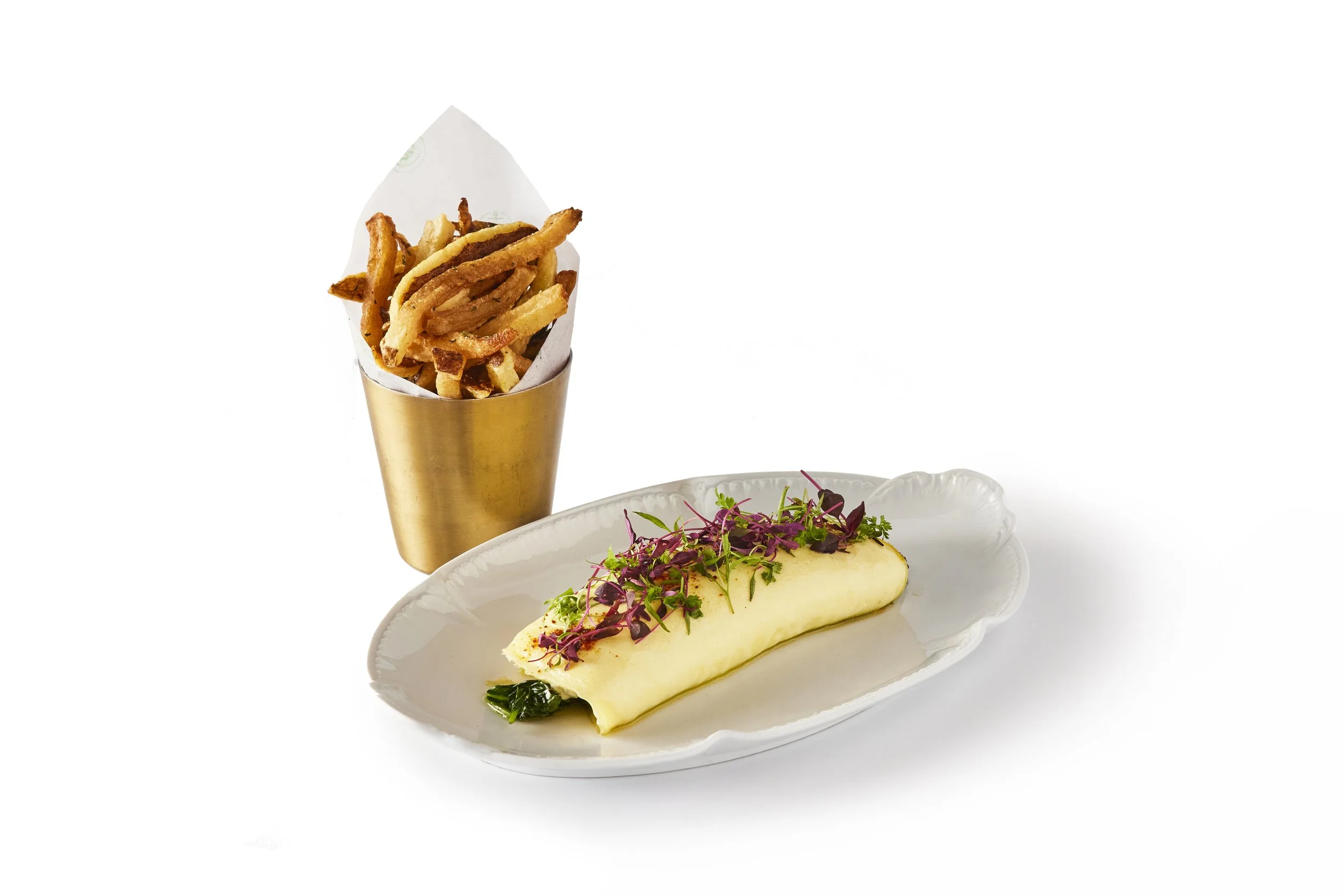 French fries in a gold cup and a plate with a rolled omelette garnished with microgreens. Robert Ranfranz branding, design and ecommerce.