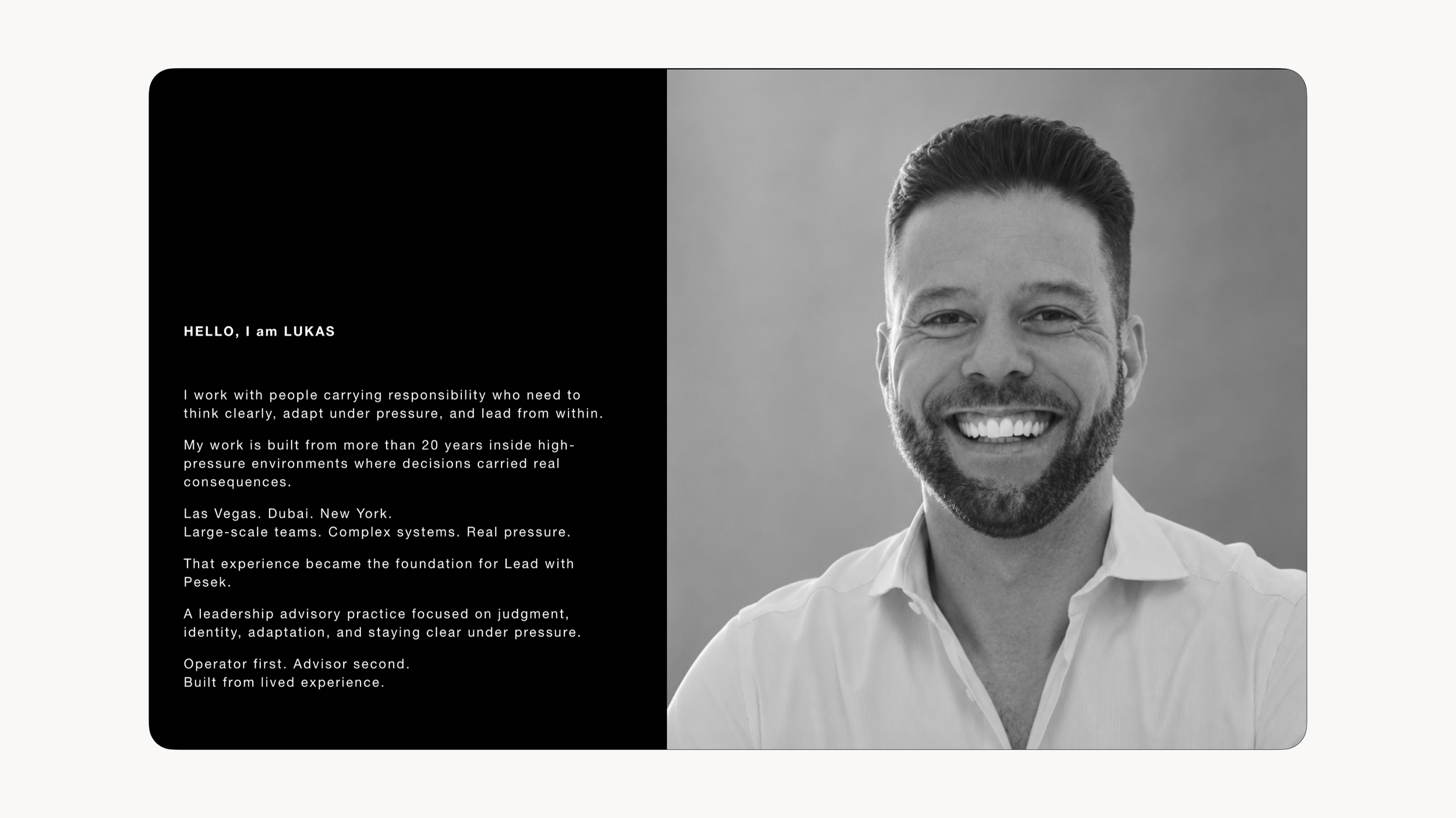 A professional headshot of a smiling man with light skin, short dark hair, a beard, wearing a white collared shirt, on a gray background. Lead with Pesek website design. Robert Ranfranz.