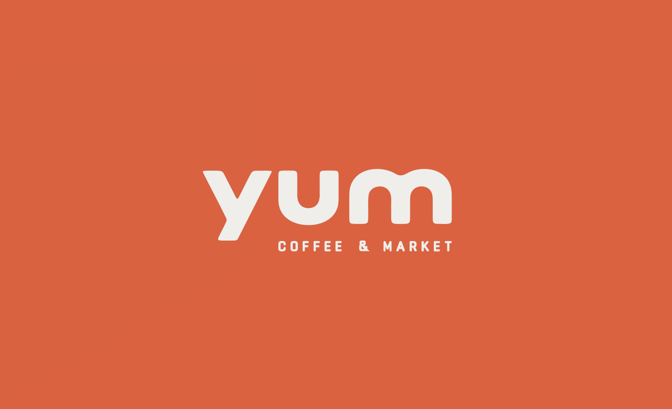 Logo for YUM Coffee & Market with orange background and white text. Robert Ranfranz branding, design and retail.