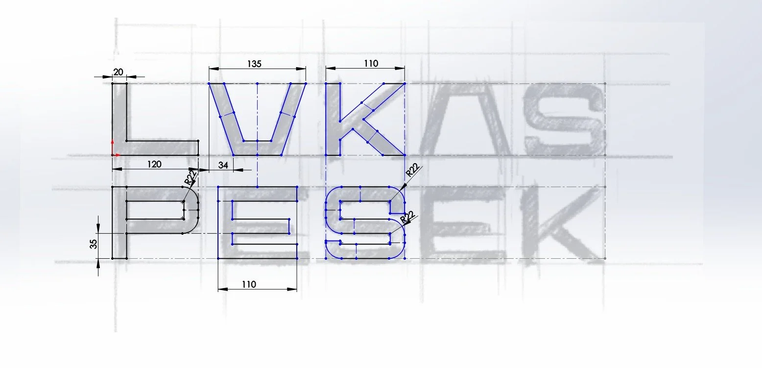Technical drawing of the word 'LUXE' with dimensions, grid lines, and construction details.