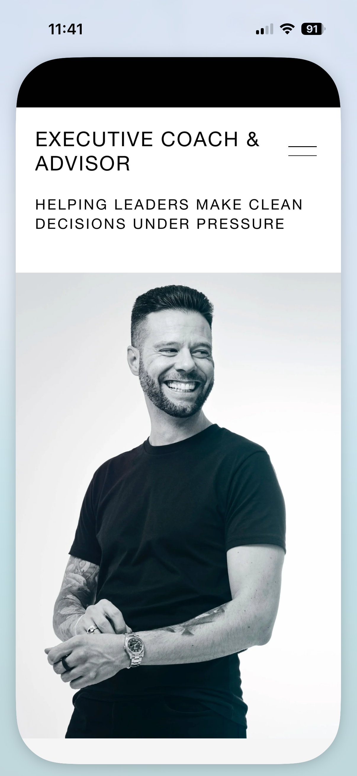 A mobile phone screen showing a professional profile for an executive coach and advisor, with a black-and-white photo of a smiling man wearing a black t-shirt and a watch.