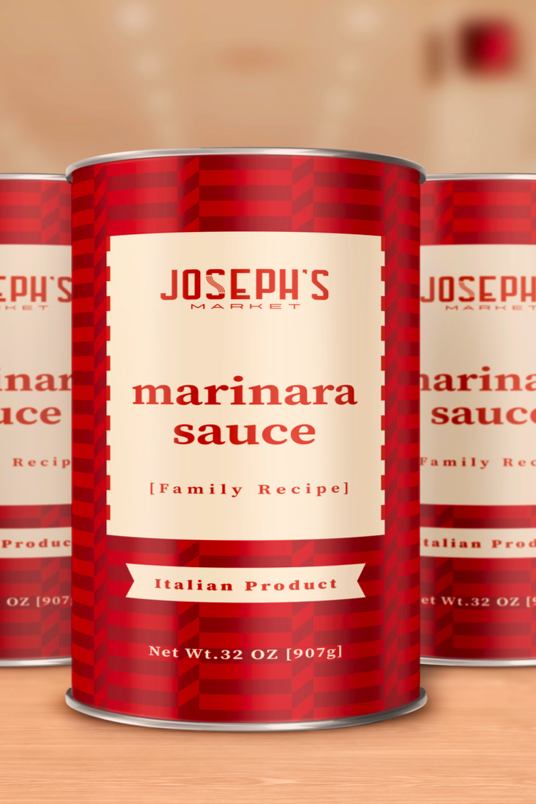 Cans of Joseph's Market marinara sauce on a wooden surface.