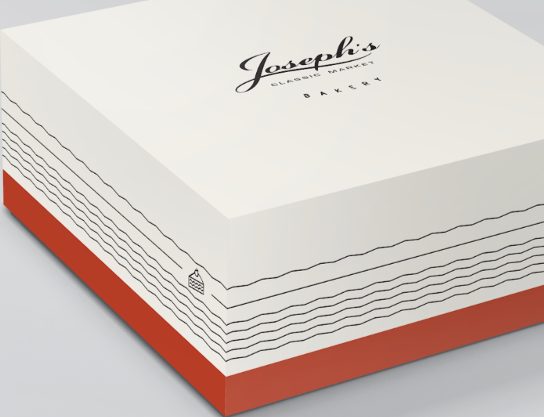 A box of Joseph's Classic Market Bakery pastries with a white top and red sides, featuring simple line drawings of slices of pie on the sides.