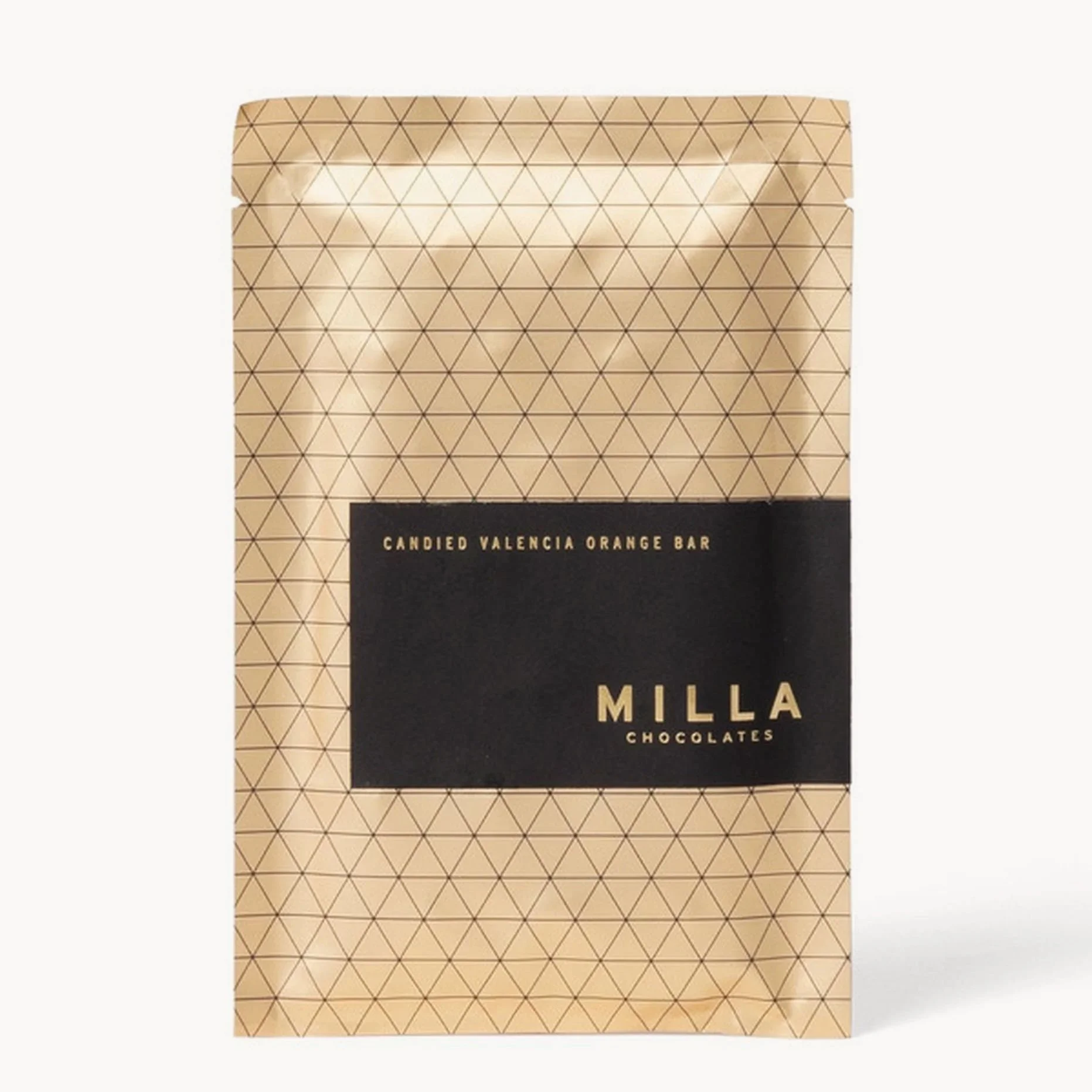 A beige bag of Milla chocolates with a black label reading "Candied Valencia Orange Bar" and a geometric pattern of small triangles.