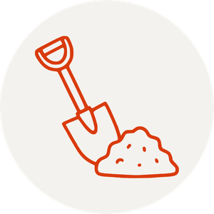 An illustration of a shovel with dirt or compost on the ground.
