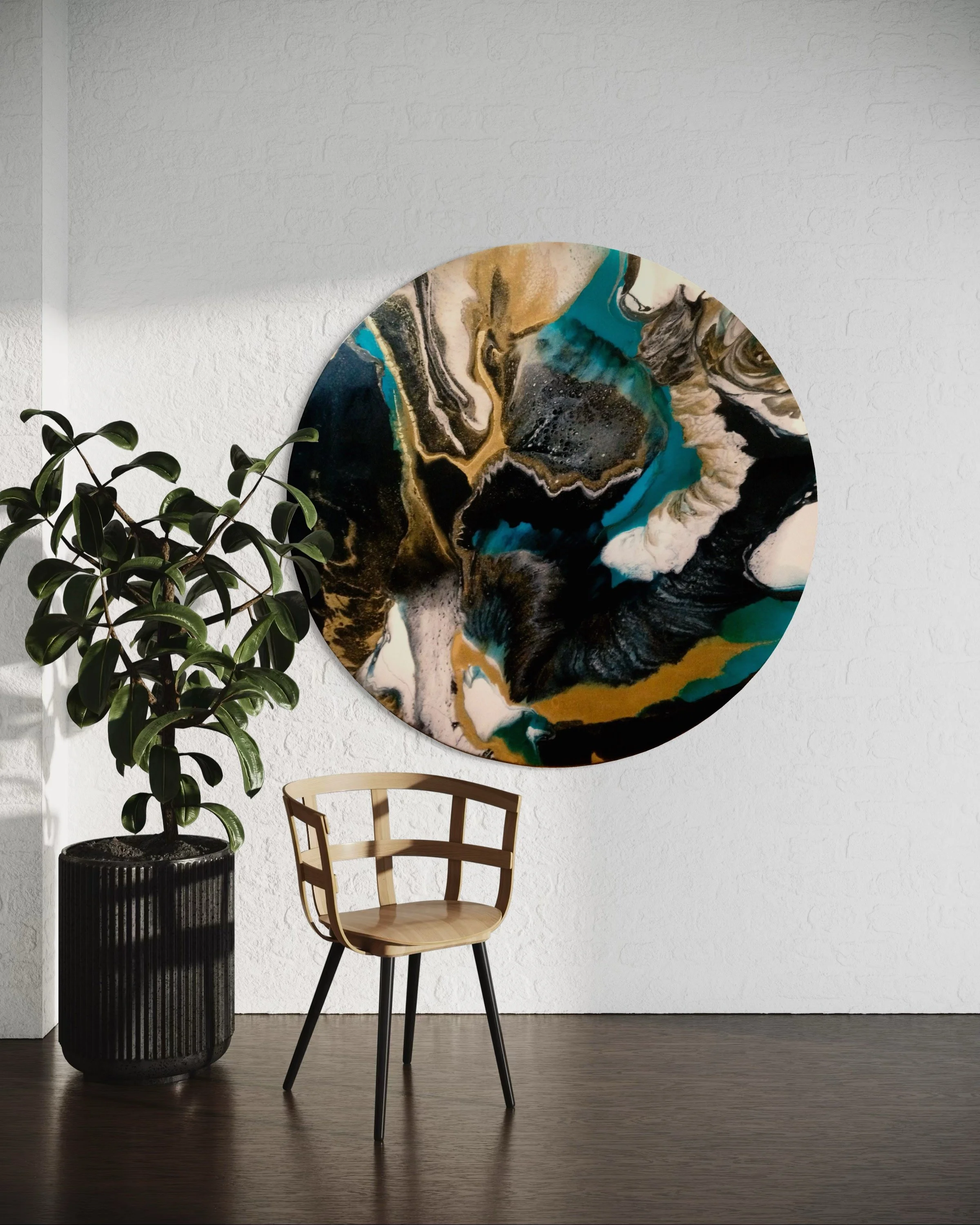 A modern interior with a large abstract circular wall art featuring black, white, beige, teal, and gold colors, a tall green houseplant in a black textured pot, and a light wood chair with black legs on a dark wood floor against a white textured wall.