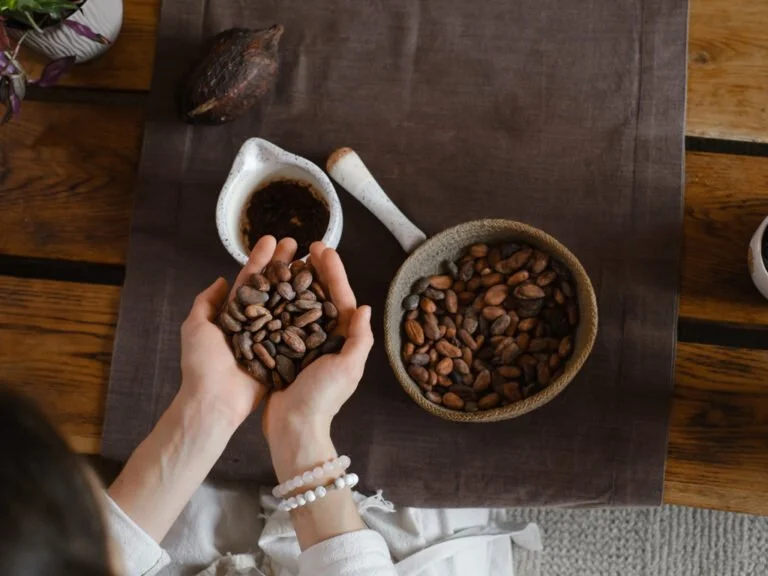 woman-hands-holding-organic-cacao-beans-for-ceremo-2022-11-11-10-10-34-utc-1-768x576.jpg