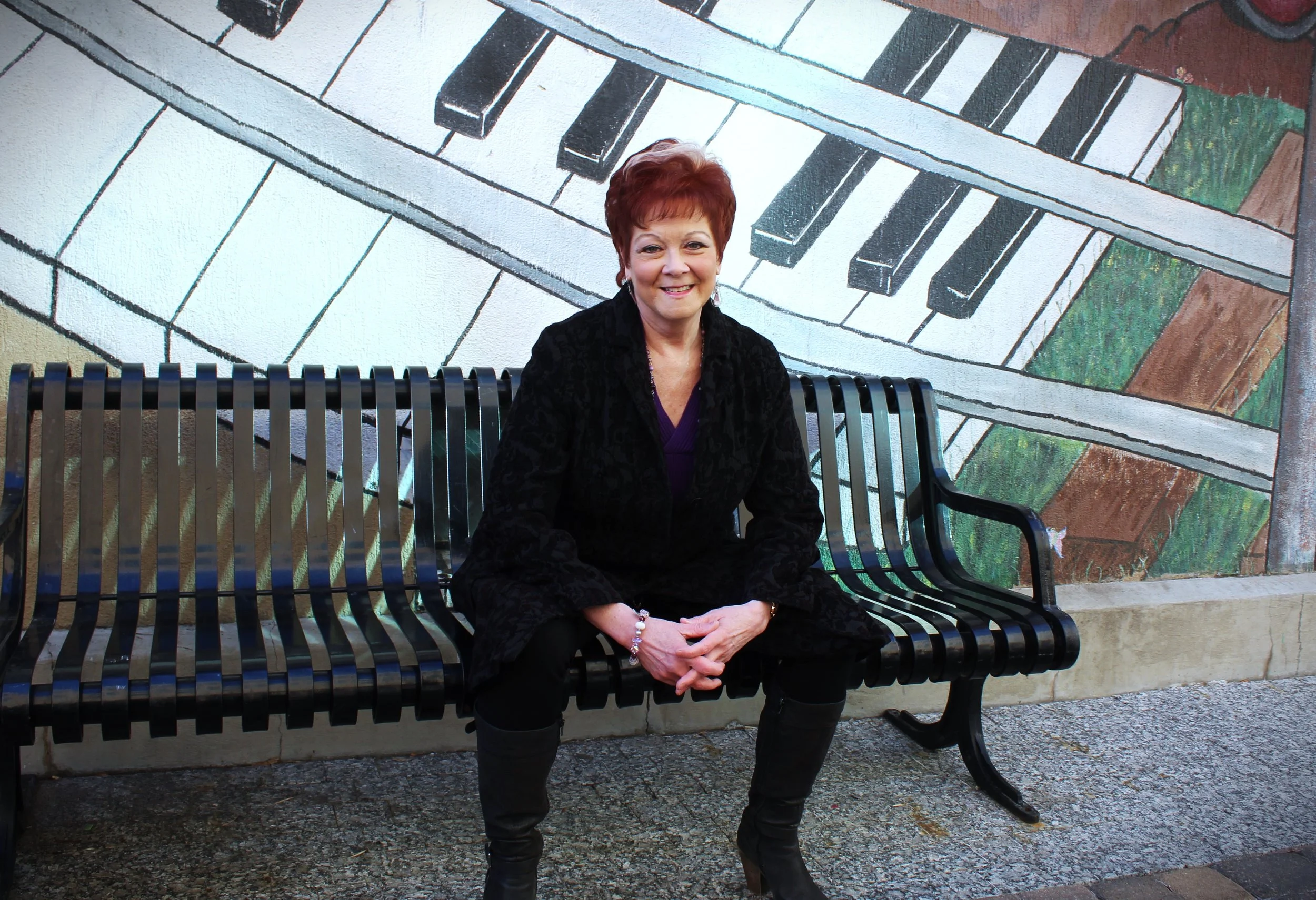 Kimberly Solo - Sitting on Bench Smiling (Mid Shot).JPG