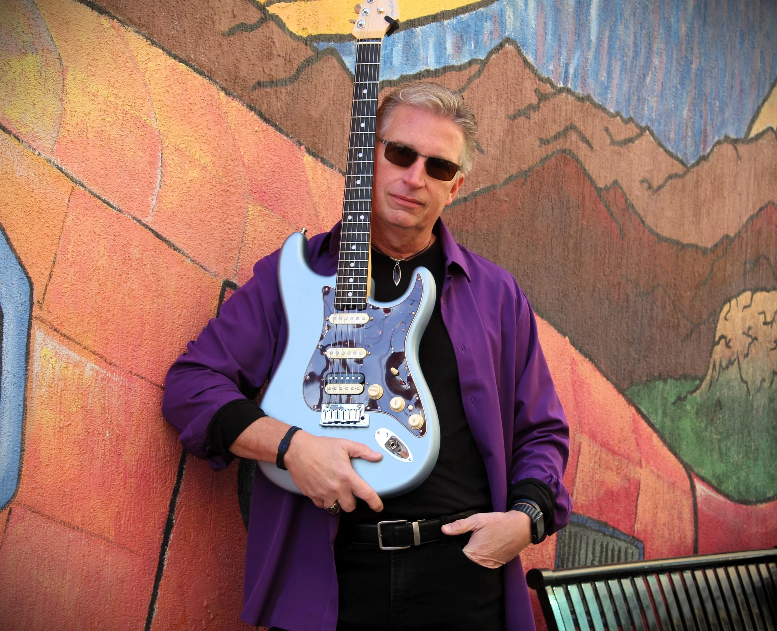 James Solo Holding Guitar at Chest.JPG