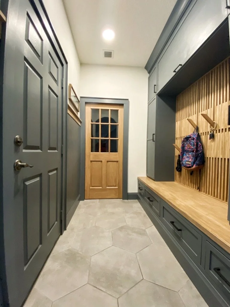 custom mudroom builtins with piano style hanging piece