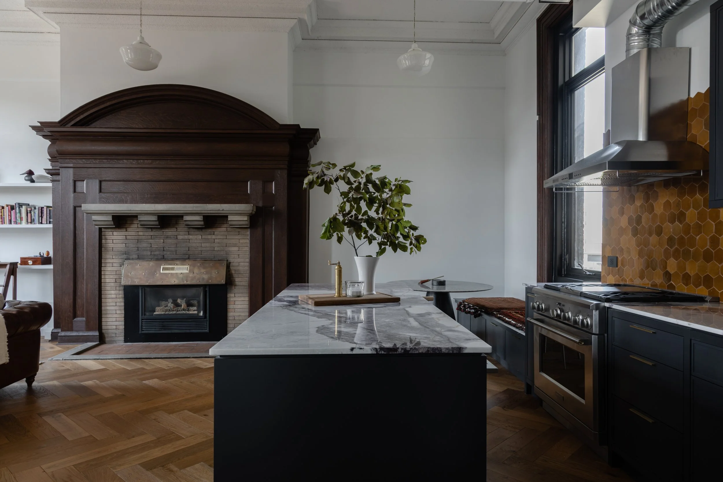 Winnipeg residential kitchen fireplace by Canvas Design Studio