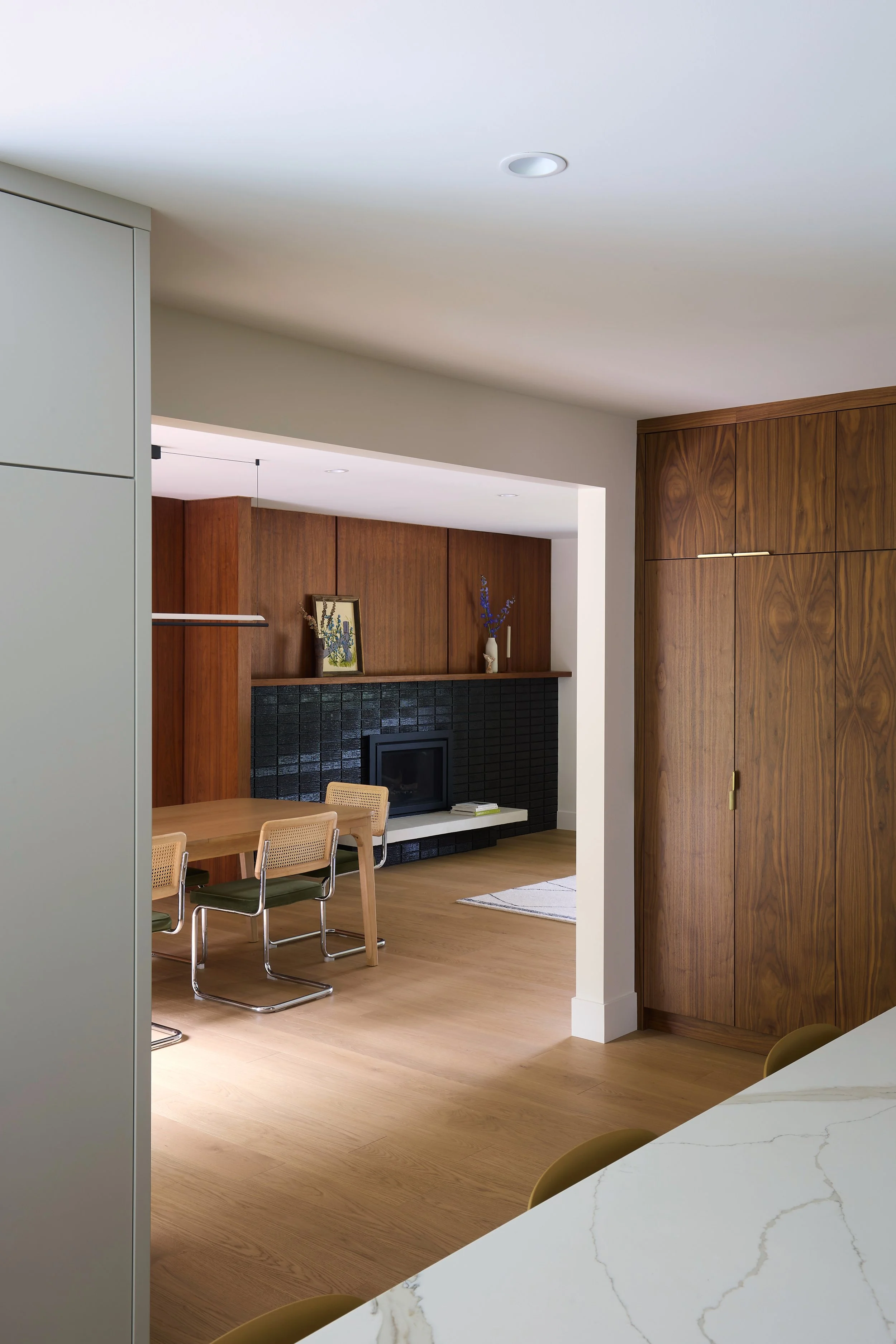 Winnipeg residential kitchen dining room fireplace by Canvas Design Studio