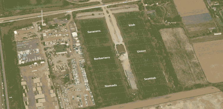 Aerial view of a farm with fields labeled 'Saracens,' 'Barbarians,' 'Nomads,' 'Irish,' 'Union,' and 'Scottish,' with roads and structures nearby.