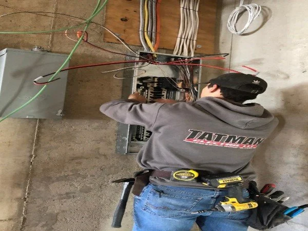 Tatman Electric electrician inspecting and servicing residential electrical panel wiring Pittsburgh PA