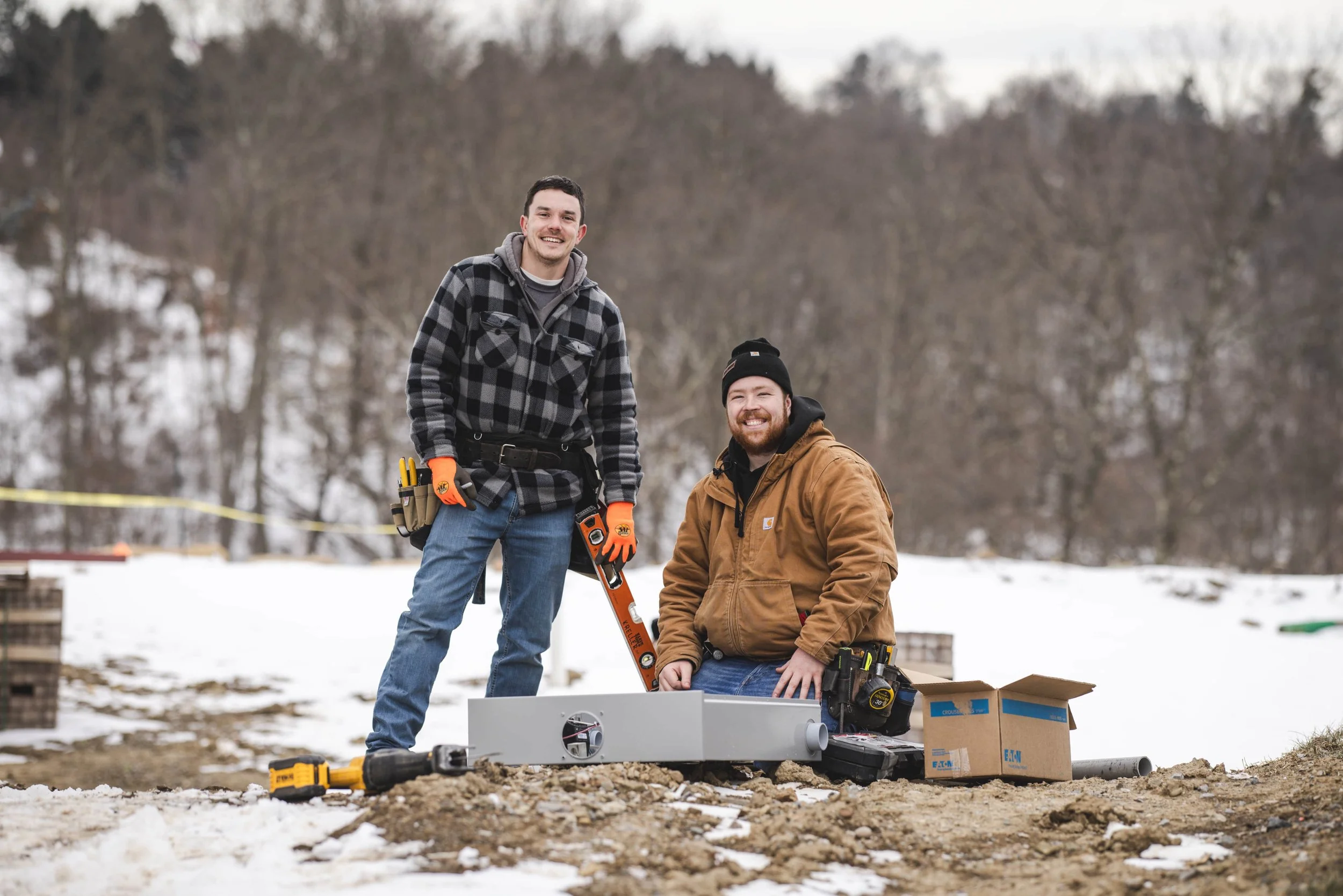 Tatman Electric electricians at outdoor winter job site in Pittsburgh PA residential new construction