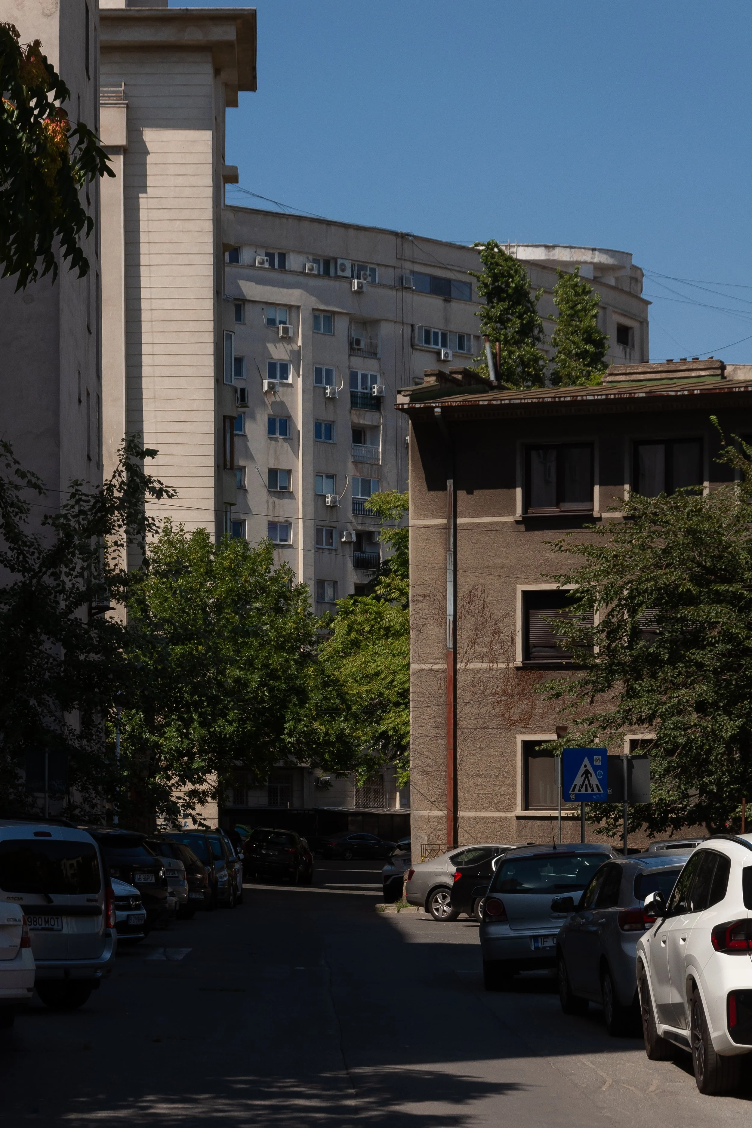 Old house behind communist block in Bucharest