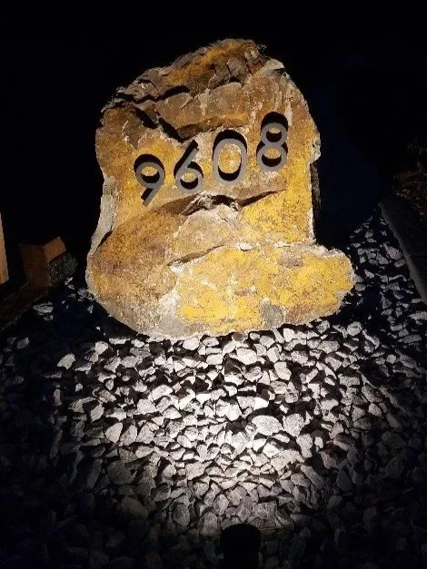 Custom boulder with house number sign