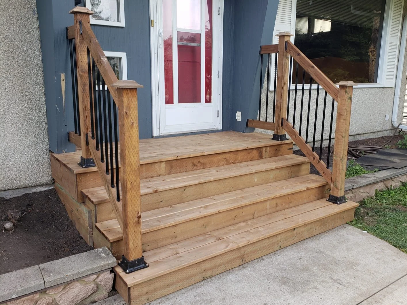 Wooden porch and railing, house entrance stairs