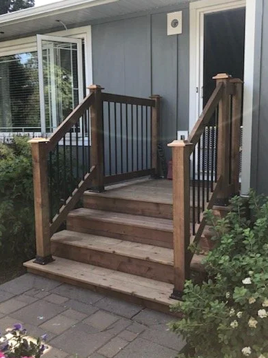 Wooden porch and railing, house entrance stairs