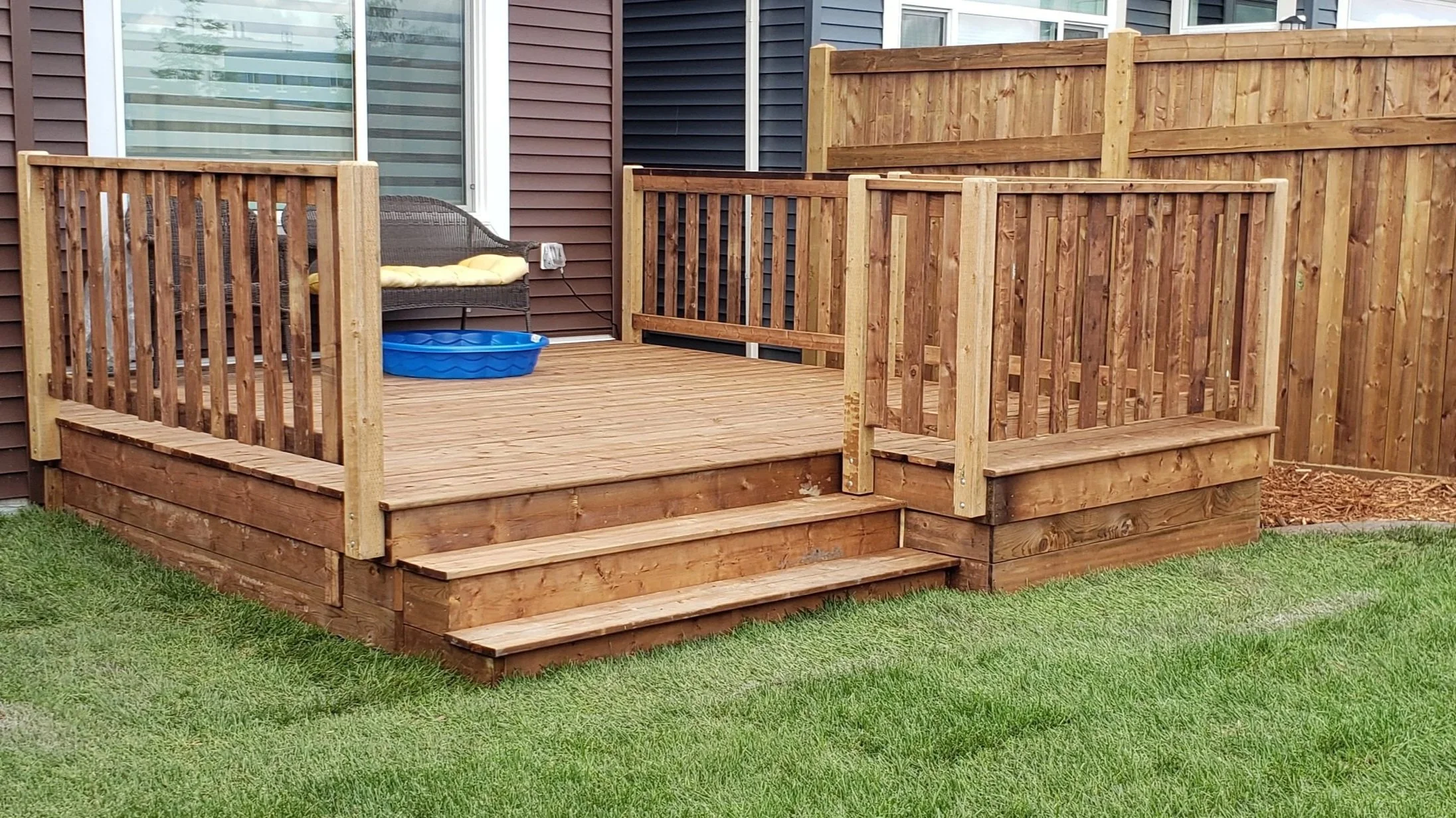 Wooden deck, preassure treated lumber, wooden railing, wooden stairs, wooden porch